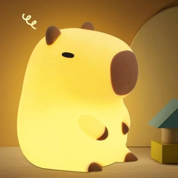 Cute capybara-shaped silicone night light glowing warm yellow